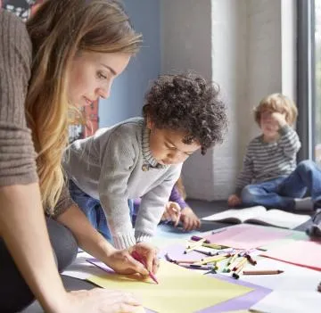 Teacher working with student
